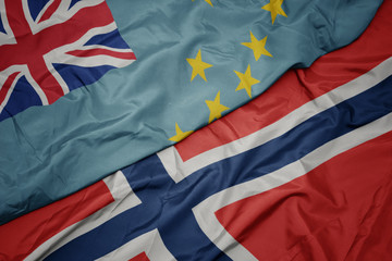 waving colorful flag of norway and national flag of Tuvalu ,.