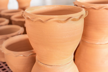 Empty ceramic brown flower pots for sale in Garden shop, Lots of orange brown terracota flower pots.