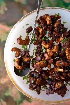 Overhead view of tamarind spiced mixed nuts on cake stand