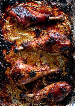 Overhead view of roasted turkey drumsticks with star anise and soy sauce
