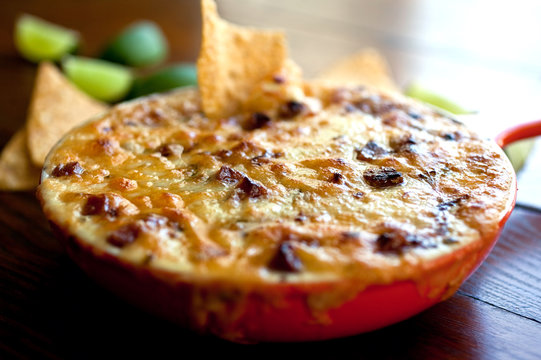 Close up of queso flameado with chorizo in frying pan