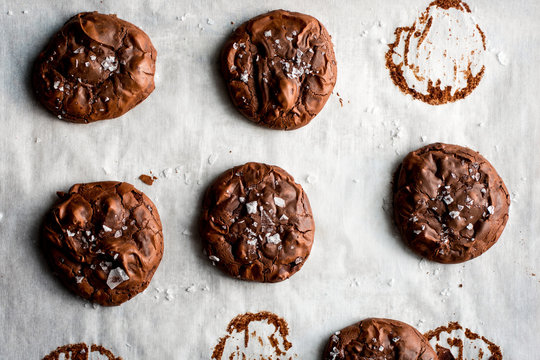 Overhead view of flourless cocoa cookies on parchment paper