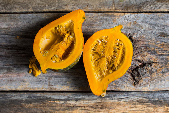 Close up of halved gourd on wooden table