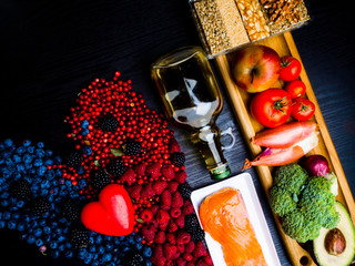 Selection of food that is good for the heart, wooden background full of vitamins and antioxidants, healthy eating