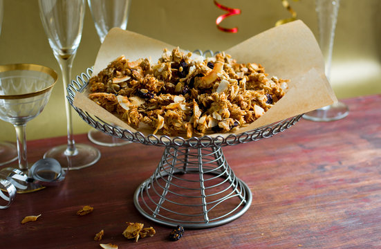 Close up of granola clumps on cake stand