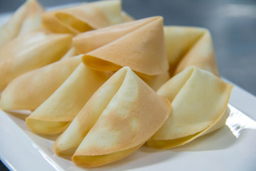  surprise fortune cookies on white plate