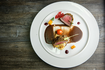 top view on finely decorated medium raw grilled meat pieces
