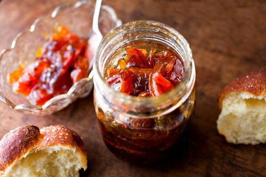 Close up of nectarine lemon verbena jam with bread on table