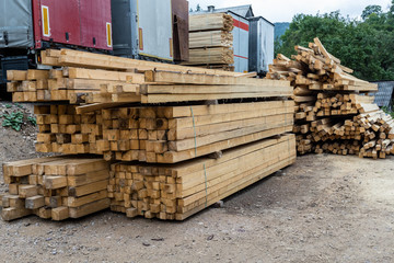 Stack of natural rough wooden boards.