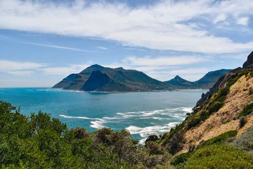 Fototapeten Hout Bay and suurounding mountains against sea and sky on summer day © Christian Horz