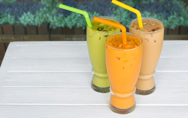 Green tea Thai tea white tea on white table.