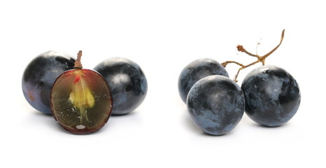Fresh dark, black half grapes isolated on white background