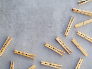 Flat lay wooden clothes pegs. Top view frame zero waste concept with copy space