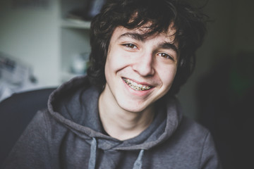 Portrait of smiling teenage boy wearing braces