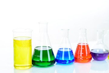 Laboratory glassware with colorful chemical reagent in research laboratory 