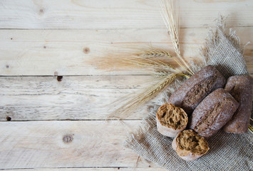 Healthy breakfast cereal bread (burlap napkin on wooden background)