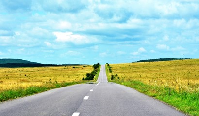 a straight road on a field