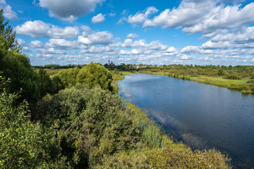 Summer rural landscape with the Lukh River in the village of Myt, Russia.