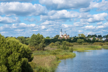 Summer rural landscape with the Lukh River in the village of Myt, Russia.