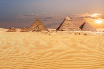 Fototapeta na wymiar Sandy desert of Giza and beautiful pyramids view