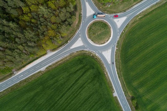 Aerial view of roundabout intersection with traffic. Franconia, Bavaria, Germany.