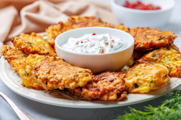 Zucchini pancakes with yogurt sauce.