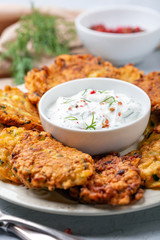 Zucchini fritters with spicy yogurt sauce.