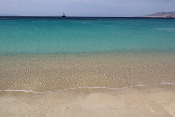 Turquoise Aegean Sea and clear beach at Agios Prokopios, Naxos, Greek Islands