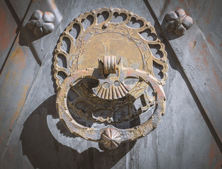 old rusty door knocker on door