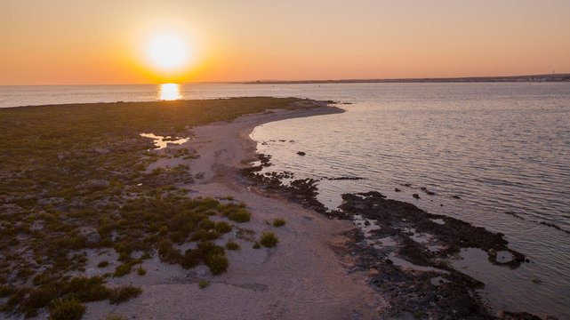 isola della malva puglia al tramonto sul mare wallpaper background image 