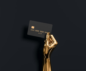 Abstract Gold hand sculpture holding credit card, The best banking offer for VIP customers. 3d illustration - obrazy, fototapety, plakaty