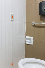 Pulling of red emergency call alert in the hospital toilet