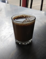 Closeup shot of milk tea glass with bubbles