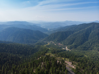 Fototapeta na wymiar Beauty day in the mountains in Altay, panoramic picture. Aerial shot on drone