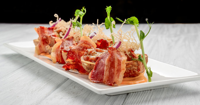 Potato skin with bacon and cheese, tomato sauce