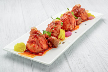 Chicken baked in tomato sauce, with vegetables