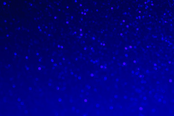 Shiny blue defocused background. Bright shiny background. Abstract background. Shine. Selective focus.