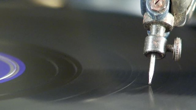 An antique phonograph playing music (macro view)