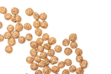 Lot of whole crispy chocolate ball breakfast cereals flatlay isolated on white background