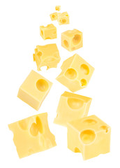 Falling cubes of cheese isolated on white
