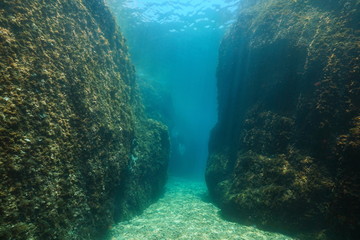 A narrow passage between large rocks underwater in the Mediterranean sea, Spain, Costa Brava, Aigua Xelida, Palafrugell, Catalonia