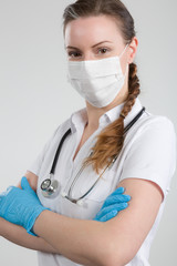 female doctor with medical face mask and stethoscope