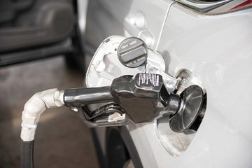 Filling A Vehicle’s Fuel Tank At A Gas Station