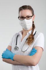 female doctor with glasses with medical face mask and stethoscope