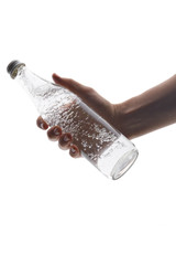 Glass water bottle in man hand on white background.