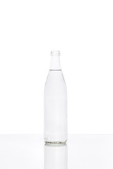 Glass water bottle on white background.