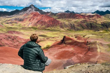 Papier Peint photo Vinicunca Hiker on Red Valley section of Rainbow Mountain hike in the Peruvian Andes near Cusco, Peru