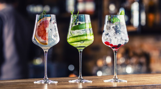 Gin Tonic Cocktails In Wine Glasses On Bar Counter In Pup Or Restaurant