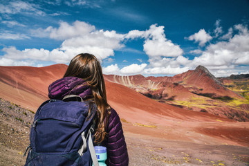 Hiker on Red Valley section of Rainbow Mountain hike in the Peruvian Andes near Cusco, Peru