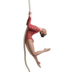 Image of graceful female gymnast hanging on rope